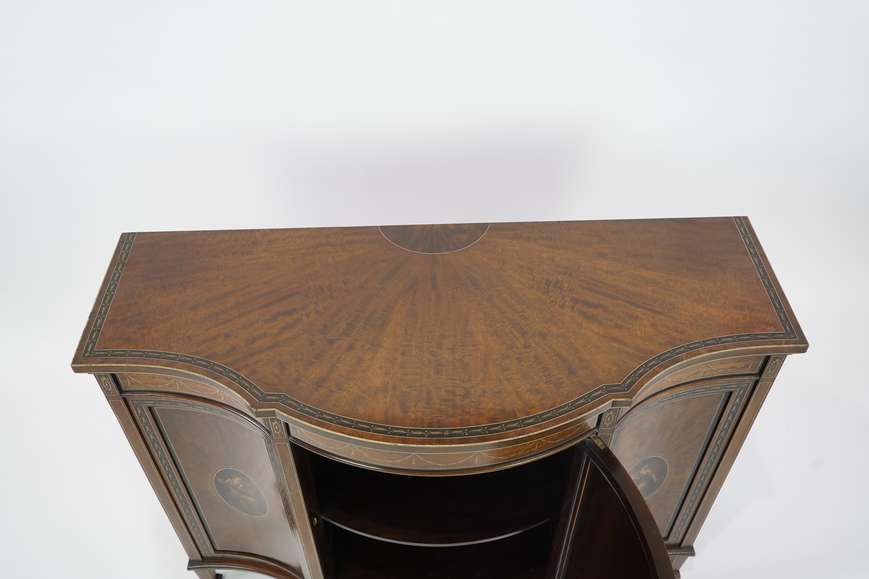 An Edwardian Sheraton Revival painted mahogany bowfront side cabinet